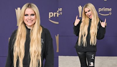Avril Lavigne Gets Distressed in Ripped Jeans and Torn Hoodie for ACM Awards 2024 Red Carpet