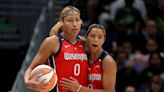 Natasha Cloud helps Shakira Austin off the court after a scary hip injury