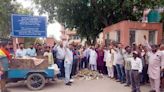 Protesting sanitation staff dump garbage outside GMADA office in Mohali