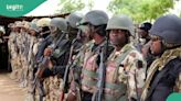 Tension as Nigerian Army stations vans at Banex Plaza in Abuja