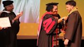 Graduating seniors receive kente stolls during Coker ceremony