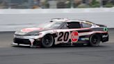 Christopher Bell takes the checkered flag on rain tires in the NASCAR Cup race at New Hampshire