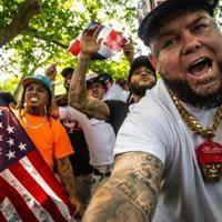 Forgiato Blow stands with other supporters of former US president Donald Trump as they gather outside of the Crotona Park rally venue in the Bronx borough on May 23, 2024 in New York City