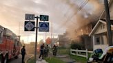 Firefighters on Middle, Malcolm X Streets in Lansing for a house fire