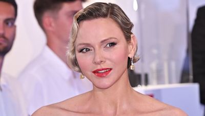 Princess Charlene epitomises Hollywood glamour in strapless gown and diamond earrings