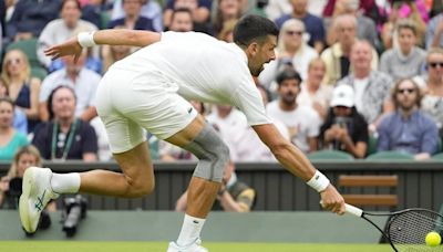 Novak Djokovic wins his first match at Wimbledon with a sleeve on his surgically repaired knee