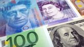 Dollar rises, pound, Swiss franc drop on busy central bank day