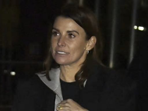 Coleen Rooney cuts a casual figure as she steps out on late night shopping trip with husband Wayne and their four sons