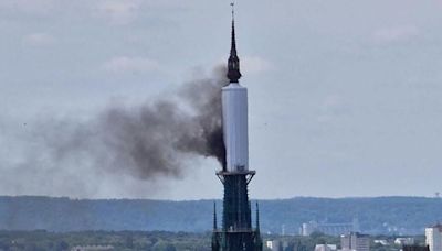 Spire of France's famous cathedral on fire