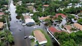 Stalled cars in flooded streets leave South Florida looking like a scene from a zombie movie