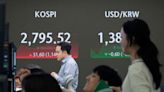 Stock market today: Asian stocks are mixed after Wall Street edges to more records