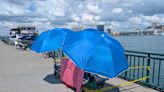 People staking out their riverfront spots ahead of Monday night's Ford Fireworks