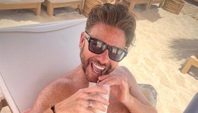 Gogglebox star Daniel Lustig soaks up the sun in tiny swimming trunks