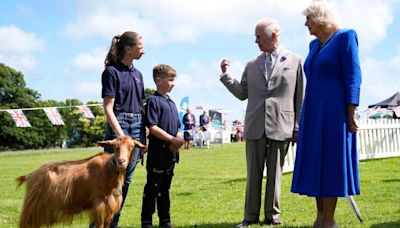 King and Queen present royal title to a goat