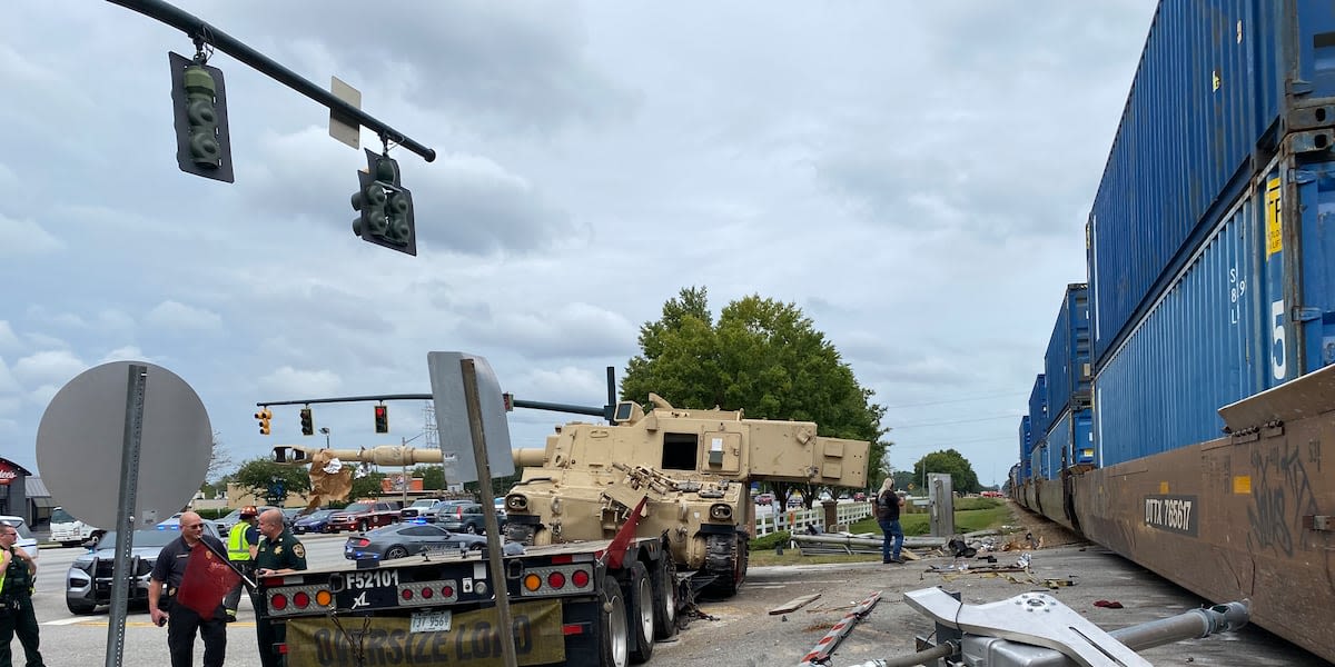 ‘Destroyed everything’: Video shows train crashing into tractor-trailer hauling military vehicle