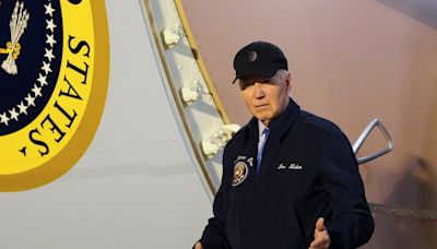 Joe Biden walks slowly off Air Force One after testing positive for Covid