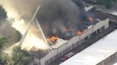 2 firefighters injured as crews battle massive fire burning in Denver-area storage facility