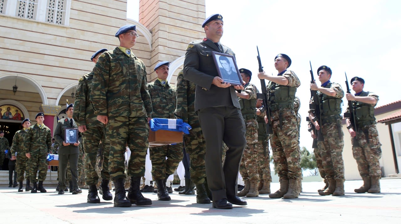 Families reclaim the remains of 15 recently identified Greek soldiers killed in Cyprus in 1974