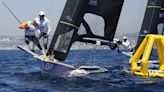 Olympic sailing ready to start with fast windsurfing, bird-like skiffs under light winds, hot sun