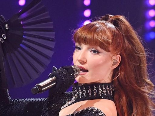 Girls Aloud star Nicola Roberts 'engaged as she reveals huge ring on stage'