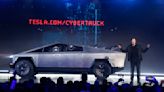 Tesla delivers about a dozen stainless steel Cybertruck pickups as it tries to fix production woes