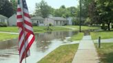 Teens help push stalled car out of flooded Hubbard road on second day of storms