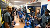 Memphis basketball team surprises elementary school students to promote literacy