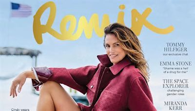 Cindy Crawford flashes her enviable legs while going pantless on the cover of Remix at a private beach in Miami