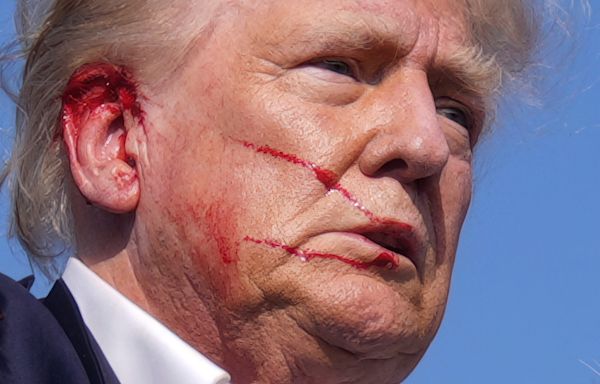 The man who photographed a bloodied and defiant Trump says he 'knew it was a moment in American history that had to be documented'