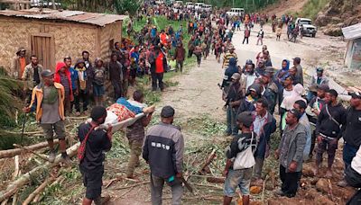 Emergency crews in Papua New Guinea move survivors of massive landslide to safer ground