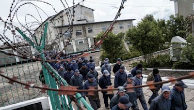 Russian POWs get to make phone calls home. Ukrainians don't. A growing movement wants that to change