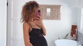 Pregnant Alyssa Scott Holds Her Baby Bump as She Poses in Lacy Black Nightgown — See the Photo!
