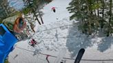Watch pro skiers jump over chair lift cables