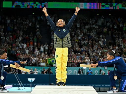 Photos preserve the most iconic moments from the Paris Olympics, including Simone Biles bowing after defeat and Noah Lyles becoming the fastest man in the world