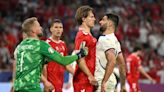 Denmark go through in second – thanks to a yellow card shown to Slovenia coach