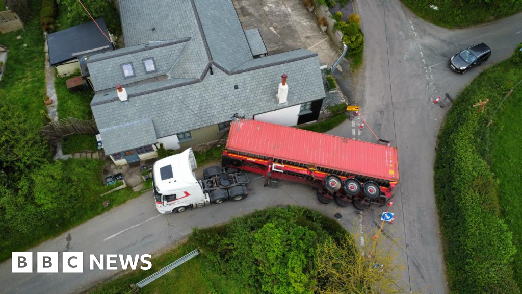 Man injured when lorry's trailer crashed into house