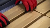 Gold edges higher on softer dollar, Fed rate-cut bets