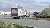 Dunkin' truck hits utility pole, causing lengthy traffic problem