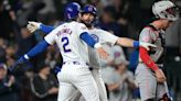 Sims serves up 2-run homer in 8th, Cubs top Reds 7-5 at wet Wrigley