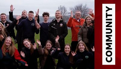 Sheffield United's Tom Davies helps plant trees in the community