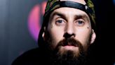 Travis Barker Leaves Tour For ‘Urgent Family Matter,’ Reportedly Posts From Prayer Room