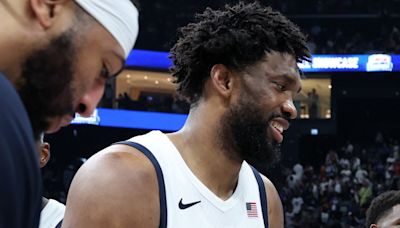 Joel Embiid seemed to be in good spirits on the bench despite his Olympic DNP against South Sudan