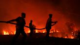 Firefighters are trying to put out a peatland fire threatening homes on Indonesia’s Sumatra Island