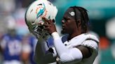 Miami Dolphins linebacker Jerome Baker warms up before a game against the Buffalo Bills at Hard Rock Stadium on Sept. 25, 2022, in Miami Gardens, Florida.