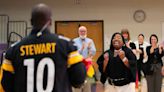 Wichita teacher surprised with visit from her NFL hero, who showed up in her school’s gym