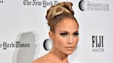 Jennifer Lopez sports XXL strawberry blonde hair extensions in cut-out swimsuit