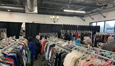 Dress for Success Triangle holding fall boutique sale