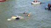 Paris mayor swims in Seine to show how clean the water is ahead of 2024 Olympics