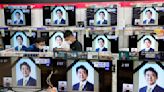 Abe's militaristic funeral captures Japan's tense mood