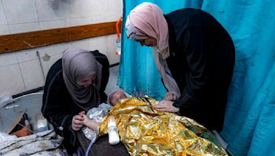 Wounded in a strike that killed her family, a 2-year-old joins Gaza's ranks of thousands of orphans